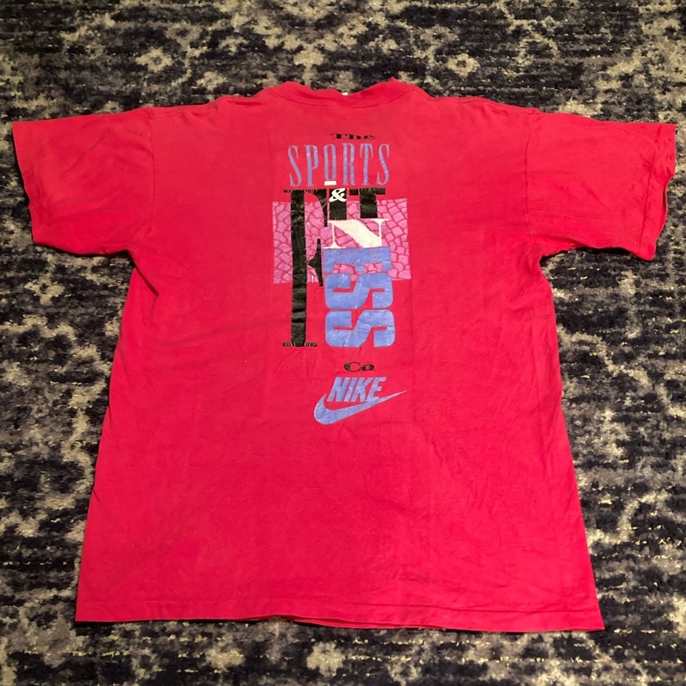 Vintage 80s Nike Distressed "The
Sports & Fitness Co. Nike" Tee Shirt